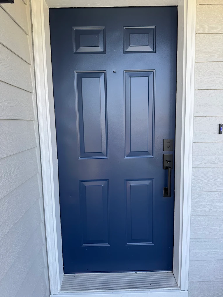 Navy front door — hand-brushed finish